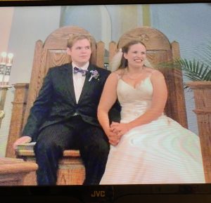 bride and groom holding hands