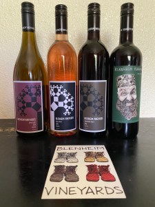 four bottles of wine on a table